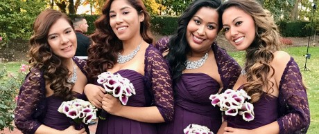 Bridesmaids wearing purple lace shawls